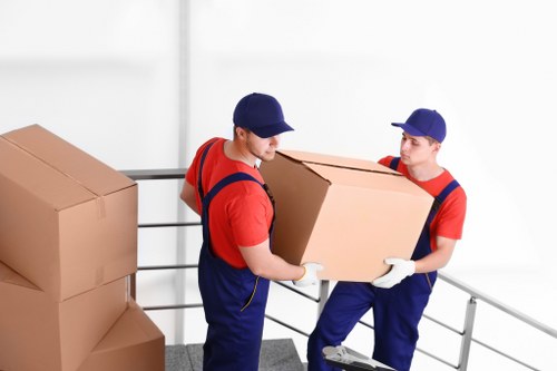 Removal team planning a house move in Riddlesdown with boxes and furniture