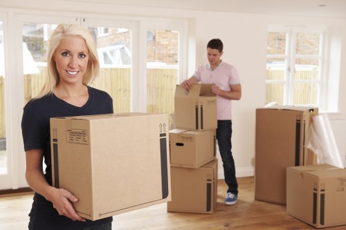 House move preparation checklist and labelled boxes in a local home