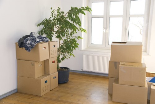 Office relocation equipment being moved by a local removals team