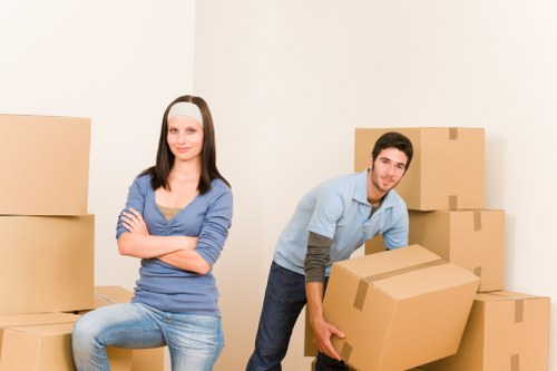 Removal team loading household items carefully