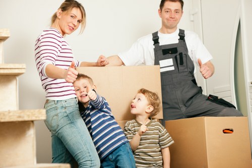 Professional movers unloading furniture at a property in Riddlesdown